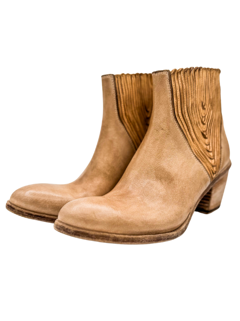 Pair of tan ankle boots on a white background