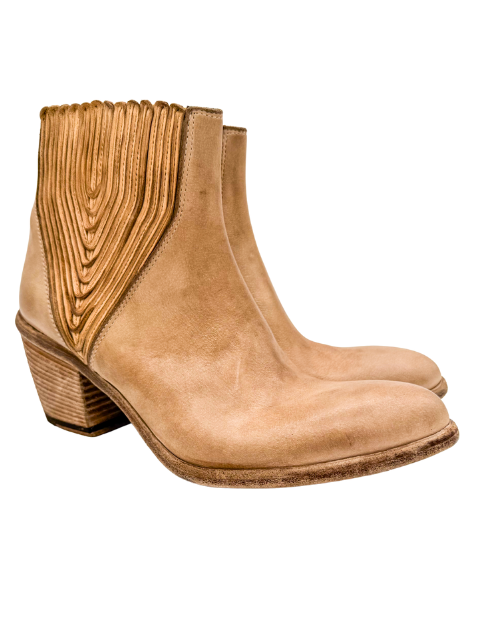 Pair of tan ankle boots with decorative side panels on a white background