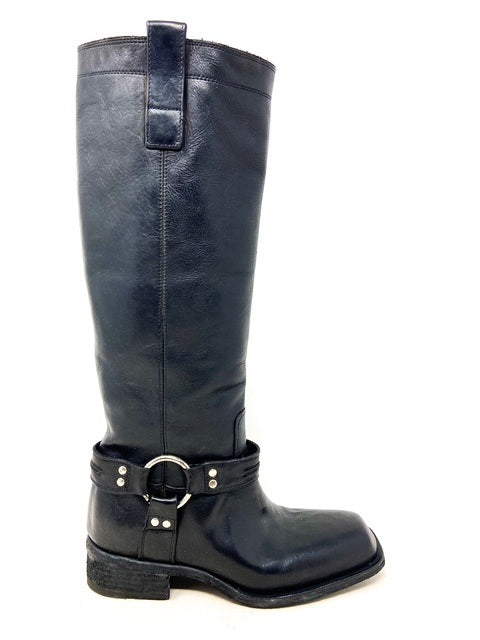 Black leather boot with a buckle on a white background