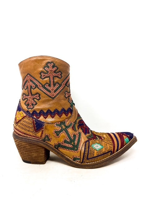 Brown embroidered boot on a white background