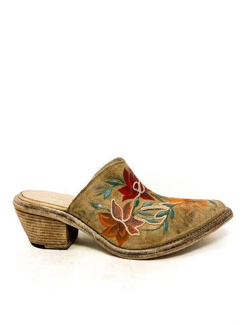 Side view of MAUI sabot crafted from buffalo leather, featuring floral artwork and leather-covered heel.